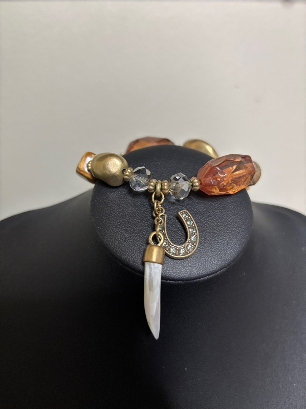 Crystal Accent Amber Beaded Stretch Bracelet with Horseshoe and Tusk Charm